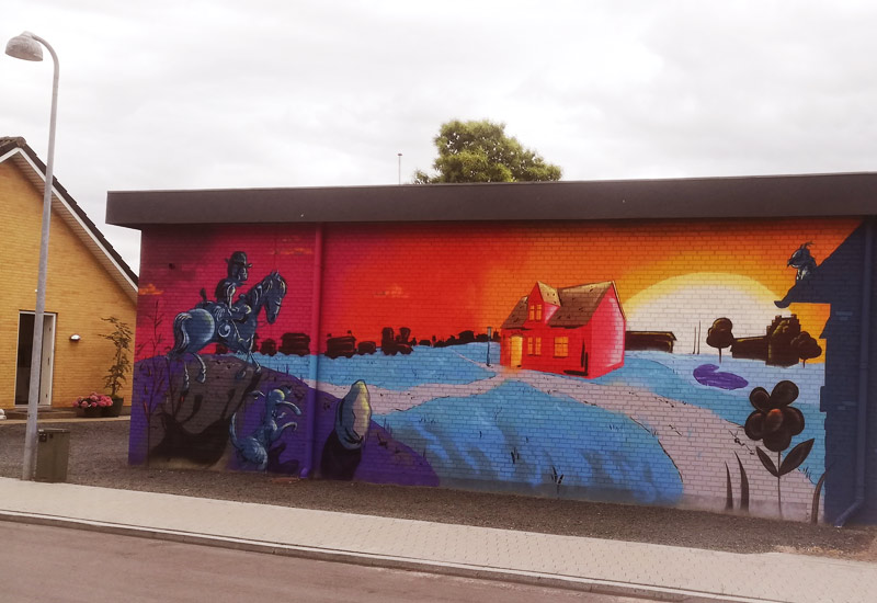 Graffiti maleri lavet i tegneseriestil til gavl i privat hjem